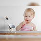 Toddler Brushing Teeth with Pink Toothbrush and Holding Toothpaste