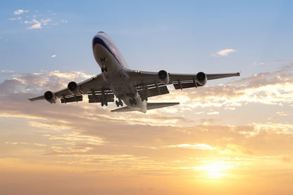 Airplane Takeoff at Sunset