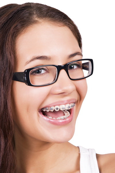 Smiling Teen with Braces and Glasses