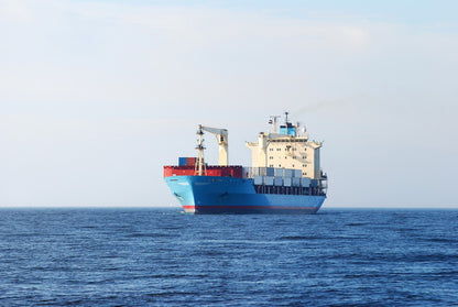 Cargo Ship Sailing on Open Sea