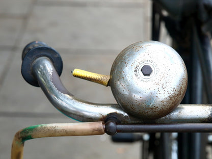 Close-Up of Rusty Bicycle Bell and Handlebar