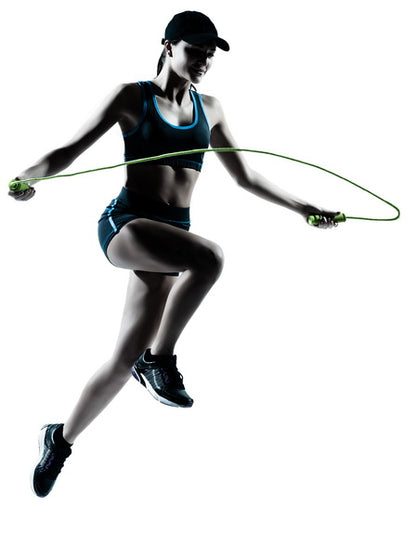 Silhouette of a Woman Jumping Rope