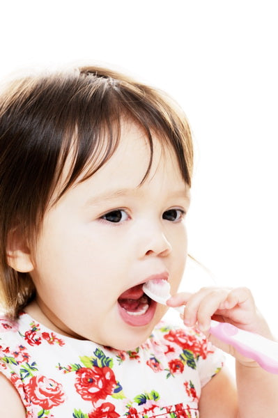 Adorable Toddler Eating with a Spoon