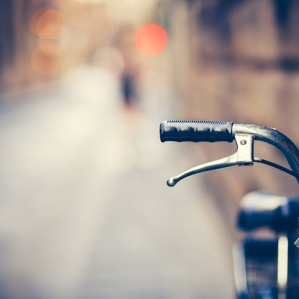 Close-Up of Bicycle Handlebar on a City Street