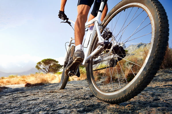 Mountain Biker on a Rocky Terrain