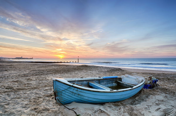 Abandoned Rowboat at Sunrise on the Beach