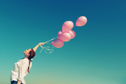 Carefree Joy: Girl with Pink Balloons