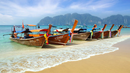 Traditional Longtail Boats on a Tropical Beach