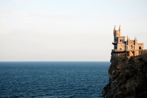 Cliffside Castle Overlooking the Sea: A Dramatic Coastal View