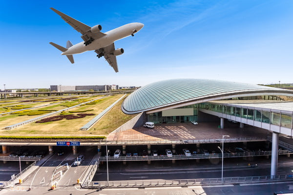 Modern Airport Aesthetic with Aircraft in Flight: Futuristic Design